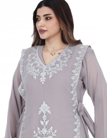 Luxurious evening Jalabiya with gemstone embroidery.