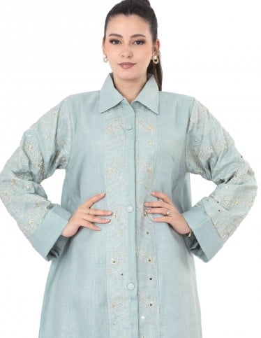 Mint shirt-style jalabiya with subtle embroidery.