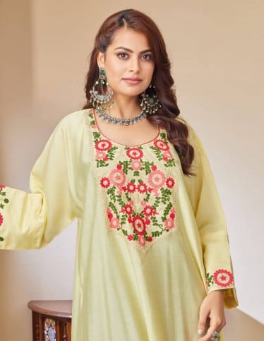 Yellow jalabiya with floral embroidery.
