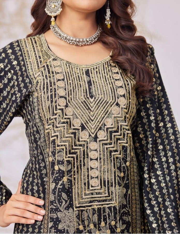 Black jalabiya with golden embroidery.