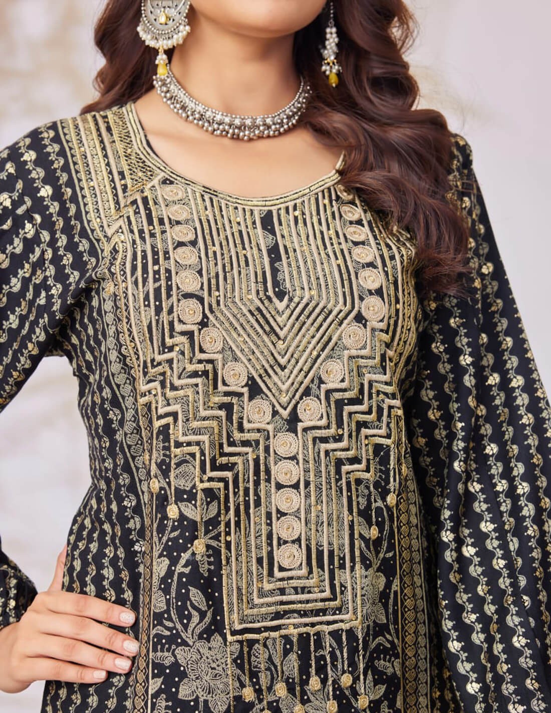 Black jalabiya with golden embroidery.