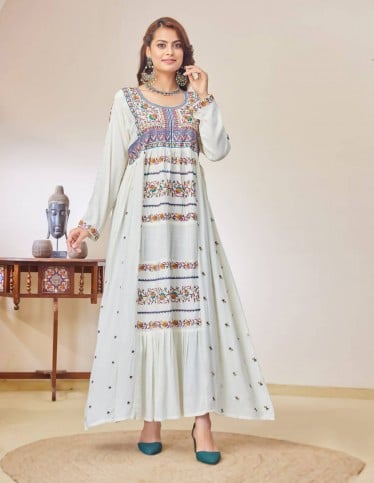 White jalabiya with heritage embroidery.