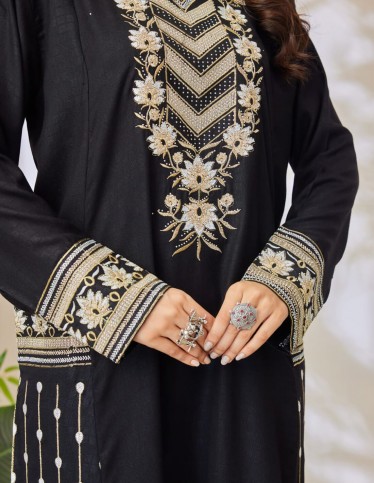 Black jalabiya with silver embroidery.