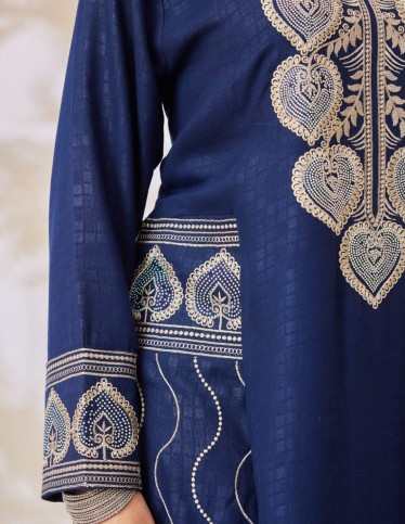 Navy jalabiya with distinctive embroidery.