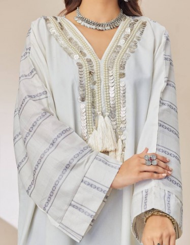 Jalabiya with golden embroidery.